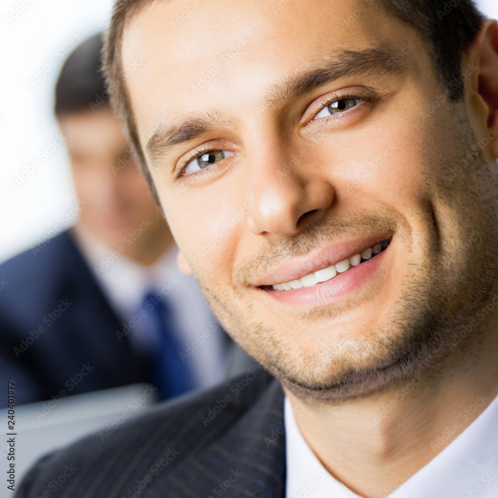 Sticker happy smiling young businessman at office