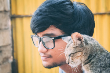 Portrait of a man wearing sunglasses with tiny kiten