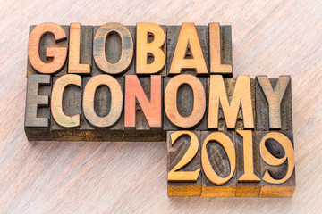 global economy 2019 word abstract in wood type