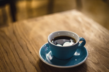 cup of coffee on wooden table