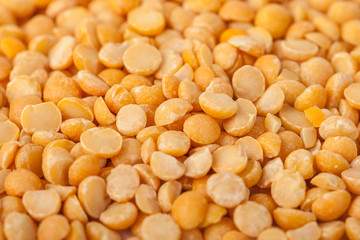 Yellow split mustard seeds for backgrounds or textures, healthy food
