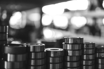 Machinery concept. Set of various gears and ball bearings old and new, BW, black and white