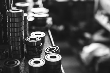 Machinery concept. Set of various gears and ball bearings old and new, BW, black and white