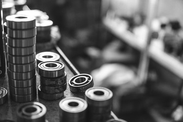 Machinery concept. Set of various gears and ball bearings old and new, BW, black and white