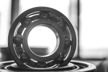 Machinery concept. Set of various gears and ball bearings old and new, BW, black and white