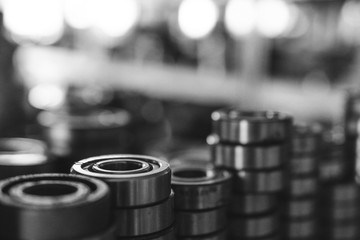 Machinery concept. Set of various gears and ball bearings old and new, BW, black and white
