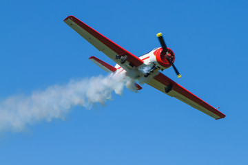 Small sports plane in the sky.
