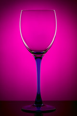 Glass on a lilac background with reflection