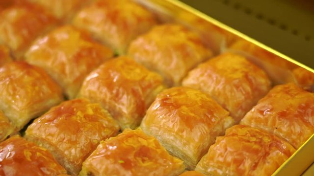 Traditional, delicious Turkish baklava with green pistachio nuts . 4k video