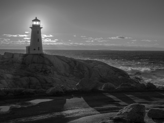 Peggy's Cove lighthouse at sunset in the winter, tourist, cold, Atlantic Ocean, seaside