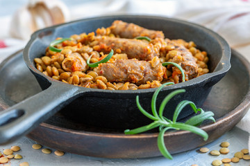Spicy lentils with rosemary and sausages.