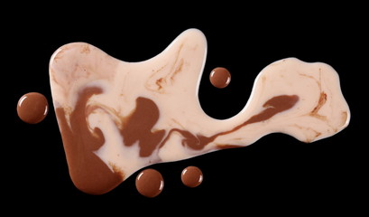 Spilled chocolate milk puddle isolated on black background, top view, clipping path