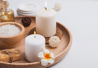 Fototapeta na wymiar Candles, body care products and accessories on the white background