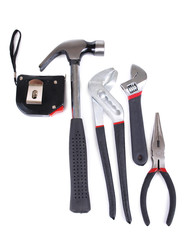 Metal screwdriver and hammer on white background