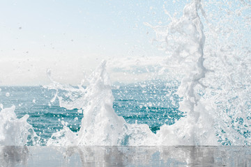 Powerful waves of the sea foaming, breaking against the rocky shore. sea textured. Athens, Greece