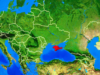 Crimea from space on model of planet Earth with country borders and very detailed planet surface.