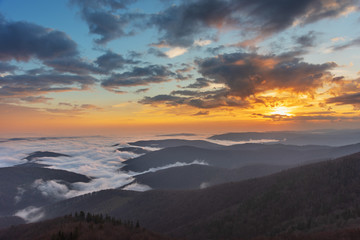 Beautiful sunrise in the Skole Beskydy with fantastic beauty over the sky, and the fog sea around the majestic Carpathian Mountains.