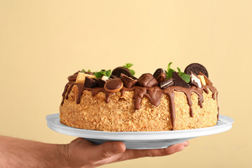 Baking on a plate in the hands close-up
