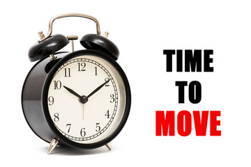 Alarm clock and text Time to Move  Time to Move concept . Time to Move concept clock closeup on...