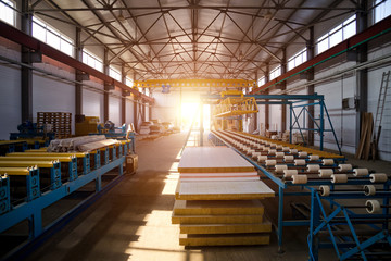 Modern thermal insulation sandwich panel production line. Machine tools, roller conveyor and...