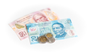 Coins and banknotes of Mexico in different denominations - The Mexican peso on white background