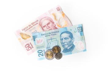 Coins and banknotes of Mexico in different denominations - The Mexican peso on white background
