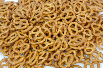 Pile of crunchy mini snack pretzels.