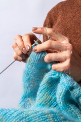 Close-up of hands knitting. Process of knitting. Hand made.