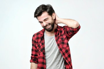 Shy guy tries to ask lovely woman for date. Portrait of happy charming young male with bristle...