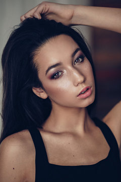 Portrait Of Beautiful Brunette Girl With Makeup In Fashion Black Clothes