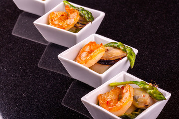 Fresh mussels and boiled shrimps with an asparagus
