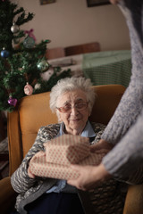 Close up of senior man giving a present to his wife.