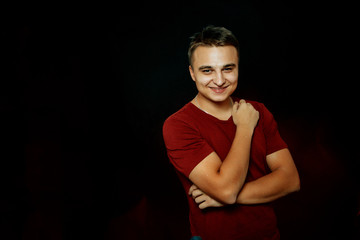 portrait of a young man on a dark background