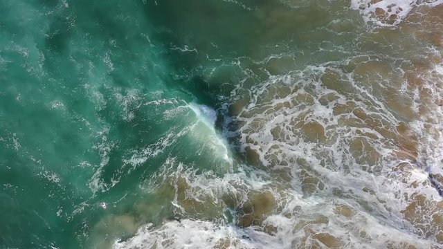 West Portugal aerial top view over Atlantic coastline ocean waves reachin Odeceixe beach