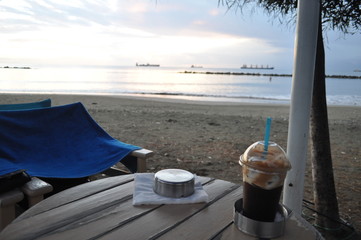A tall glass of Traditional Cold Greek Coffee frappe