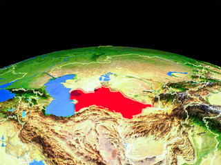 Turkmenistan on model of planet Earth with country borders and very detailed planet surface.