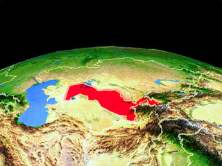 Uzbekistan on model of planet Earth with country borders and very detailed planet surface.