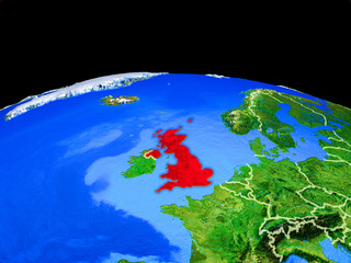 United Kingdom on model of planet Earth with country borders and very detailed planet surface.