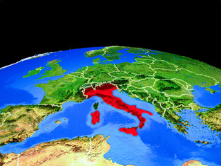 Italy on model of planet Earth with country borders and very detailed planet surface.