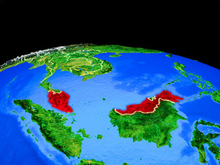 Malaysia on model of planet Earth with country borders and very detailed planet surface.