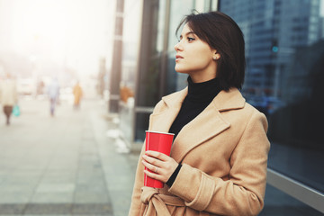 Woman Drink Her Hot Coffee While Walking On The Street. Portrait Of Stylish Smiling Woman In Winter Clothes Drinking Hot Coffee. Female Winter Style. - Image