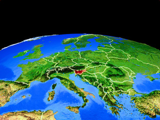 Slovenia on model of planet Earth with country borders and very detailed planet surface.
