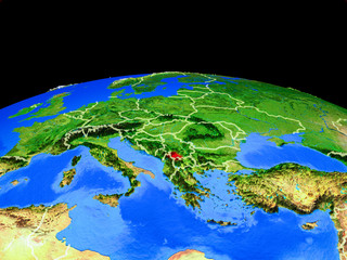Kosovo on model of planet Earth with country borders and very detailed planet surface.