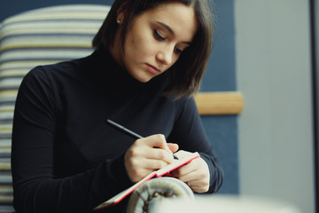 Woman Make Notes And Look Around For Ideas. Portrait Of Stylish Smiling Woman In Winter Clothes Make Notes And Look Around For Ideas. Female Winter Style. - Image