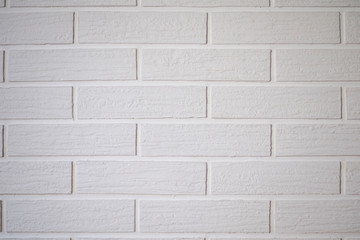 white brickwork with vertical and horizontal lines. The background