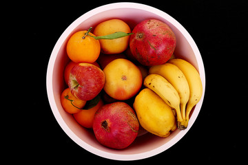 Fototapeta na wymiar fruit berries in winter berries, apple, orange, mandarin, banana, pomegranate, quince