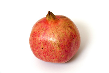 pomegranate fruit on white ground, grains of pomegranate fruit,