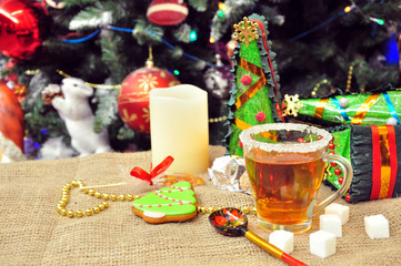 Tea in a mug on the background of Christmas decoration