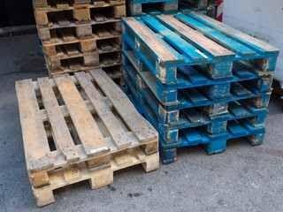 group of old wooden pallet stacked outside wharehouse