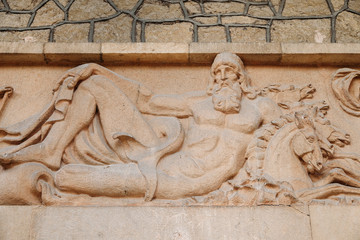 antique Beautiful bas-relief sculpture on wall ancient Greek style . God Poseidon, the giver of people water